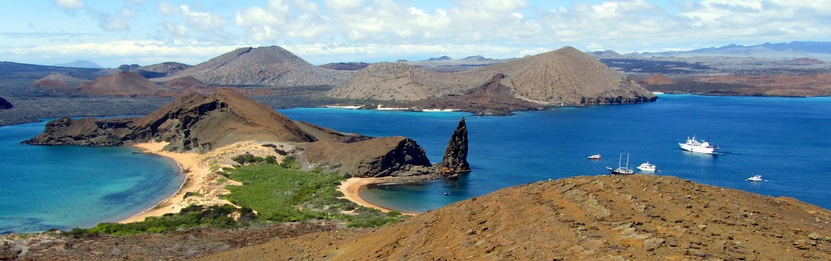 The iconic view of the Galapagos Islands. Pinnacle Rock as seen from the observation peak on St. Bartolome.