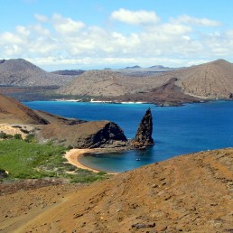 The iconic view of the Galapagos Islands. Pinnacle Rock as seen from the observation peak on St. Bartolome.