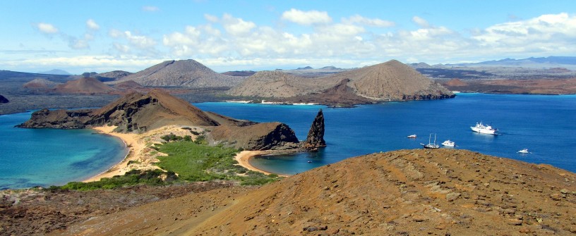 The iconic view of the Galapagos Islands. Pinnacle Rock as seen from the observation peak on St. Bartolome.