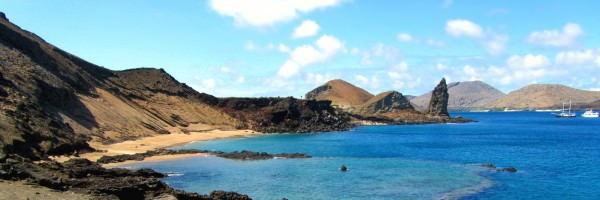 The iconic view of the Galapagos Islands. Pinnacle Rock as seen from the observation peak on St. Bartolome.